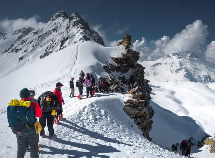 Guests trekking on the snow-clad Rupin Pass near Hotel Batseri, Sangla, Kinnaur.