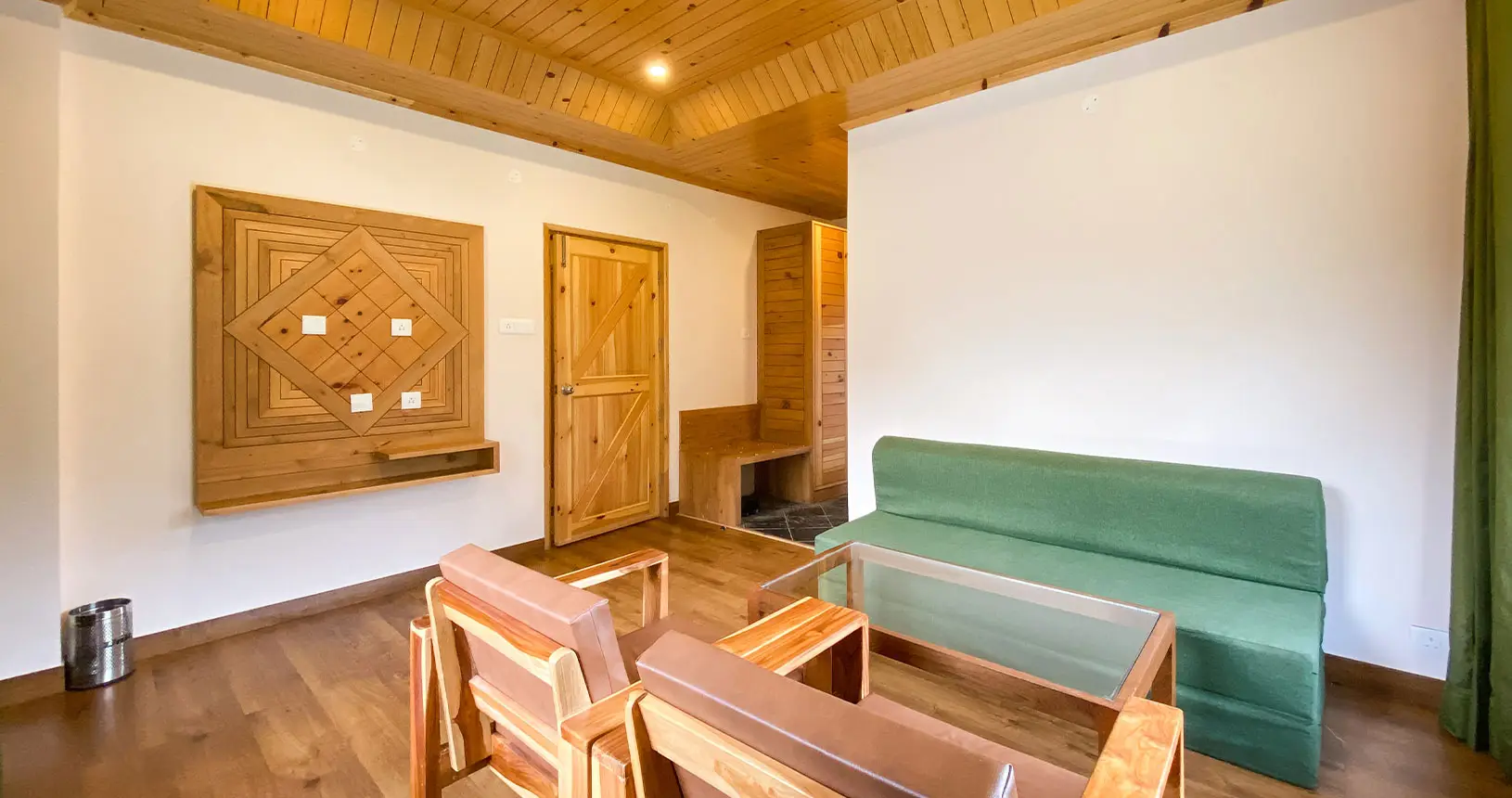 Seating area and entrance of the family suite at Hotel Batseri, Sangla.